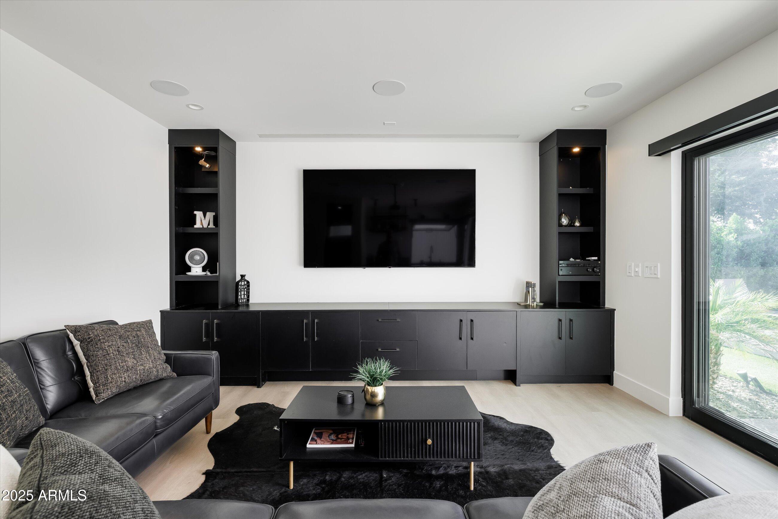 3721 East Piccadilly Road Phoenix, AZ 85018 - Photo 44 of 54 a living room with furniture and a flat screen tv