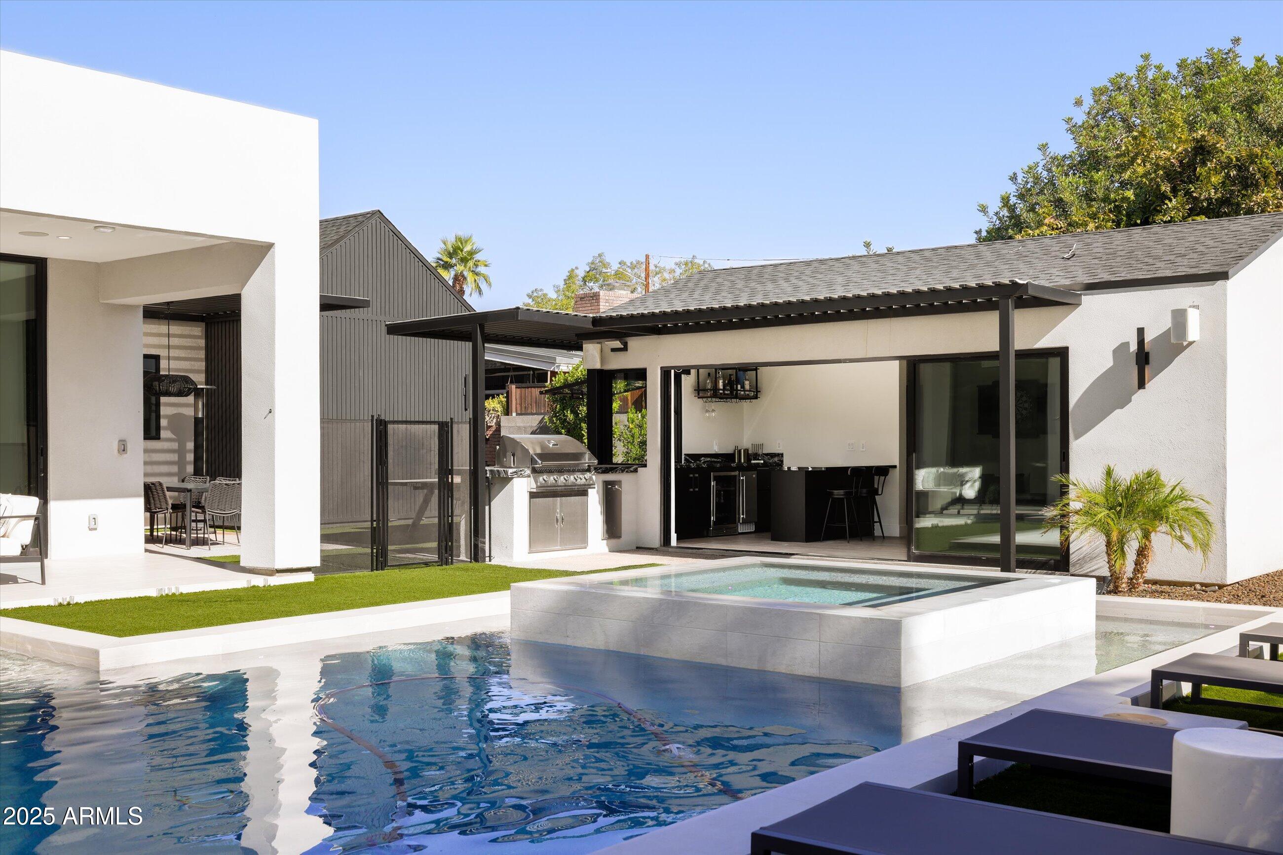 3721 East Piccadilly Road Phoenix, AZ 85018 - Photo 46 of 54 a view of a swimming pool with patio