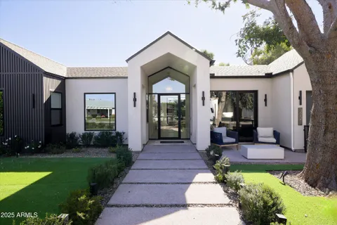 a front view of a house with garden
