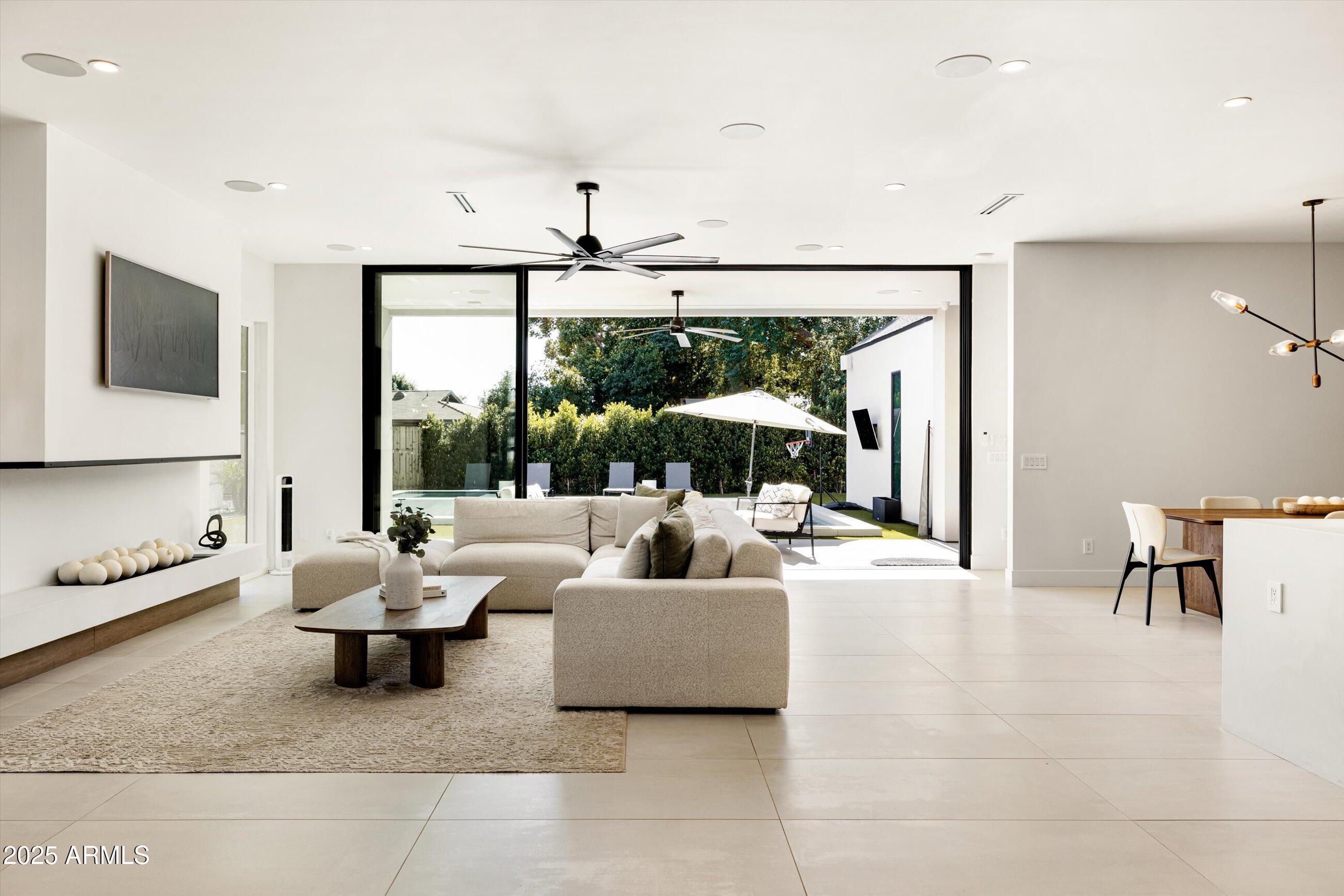 3721 East Piccadilly Road Phoenix, AZ 85018 - Photo 7 of 54 a living room with furniture and a flat screen tv