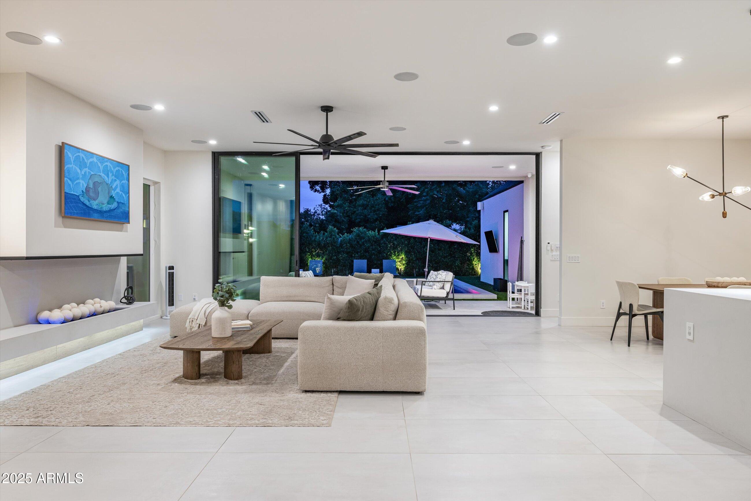 3721 East Piccadilly Road Phoenix, AZ 85018 - Photo 8 of 54 a living room with furniture and a flat screen tv