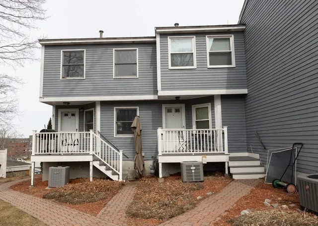 a front view of a house with a roof deck