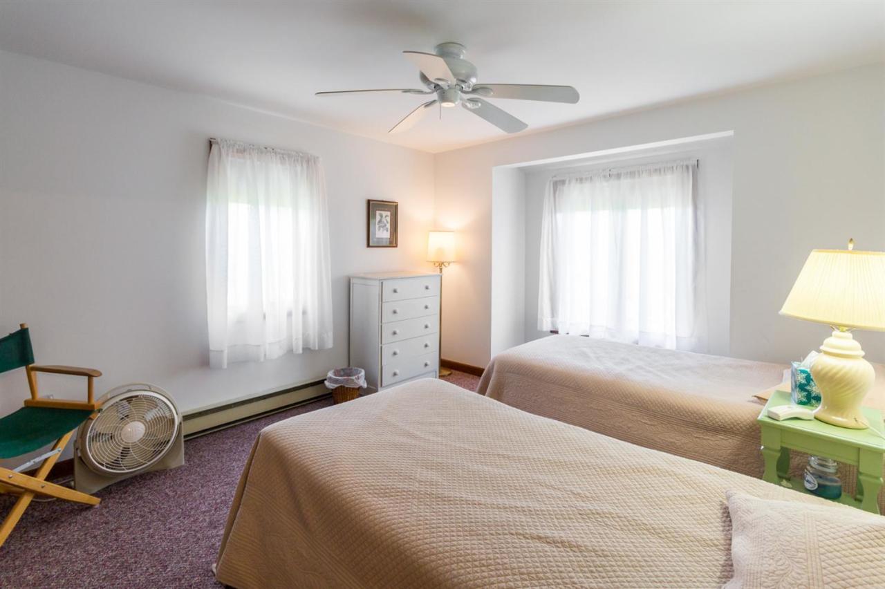 1 Schoolhouse Road Edgartown, MA 02539 - Photo 12 of 14 a bedroom with a bed and a window