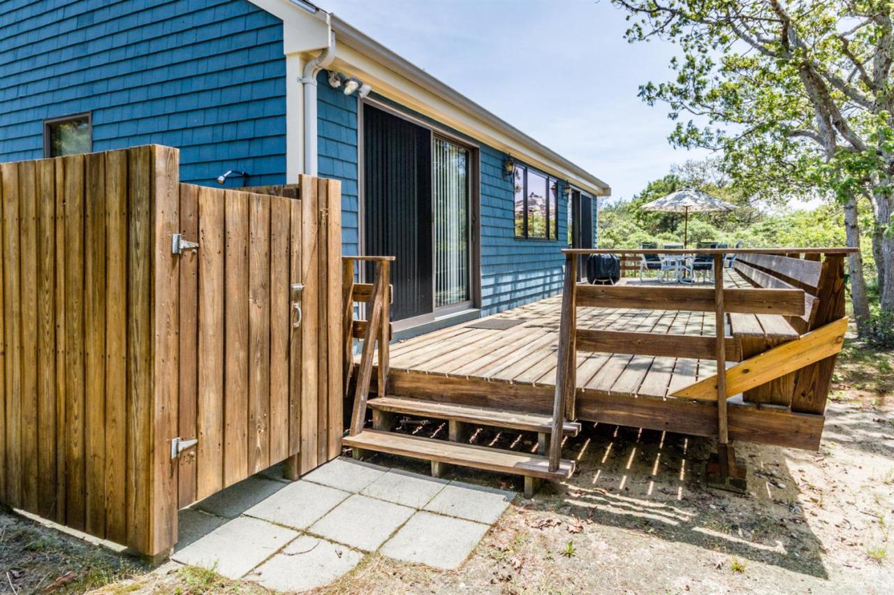 1 Schoolhouse Road Edgartown, MA 02539 - Photo 14 of 14 a view of a backyard with a deck and furniture