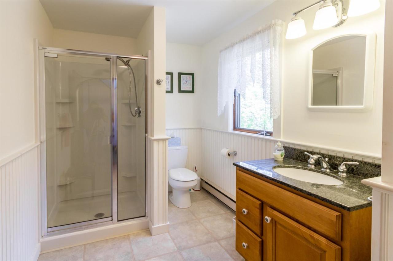 1 Schoolhouse Road Edgartown, MA 02539 - Photo 8 of 14 a bathroom with a granite countertop sink toilet and shower