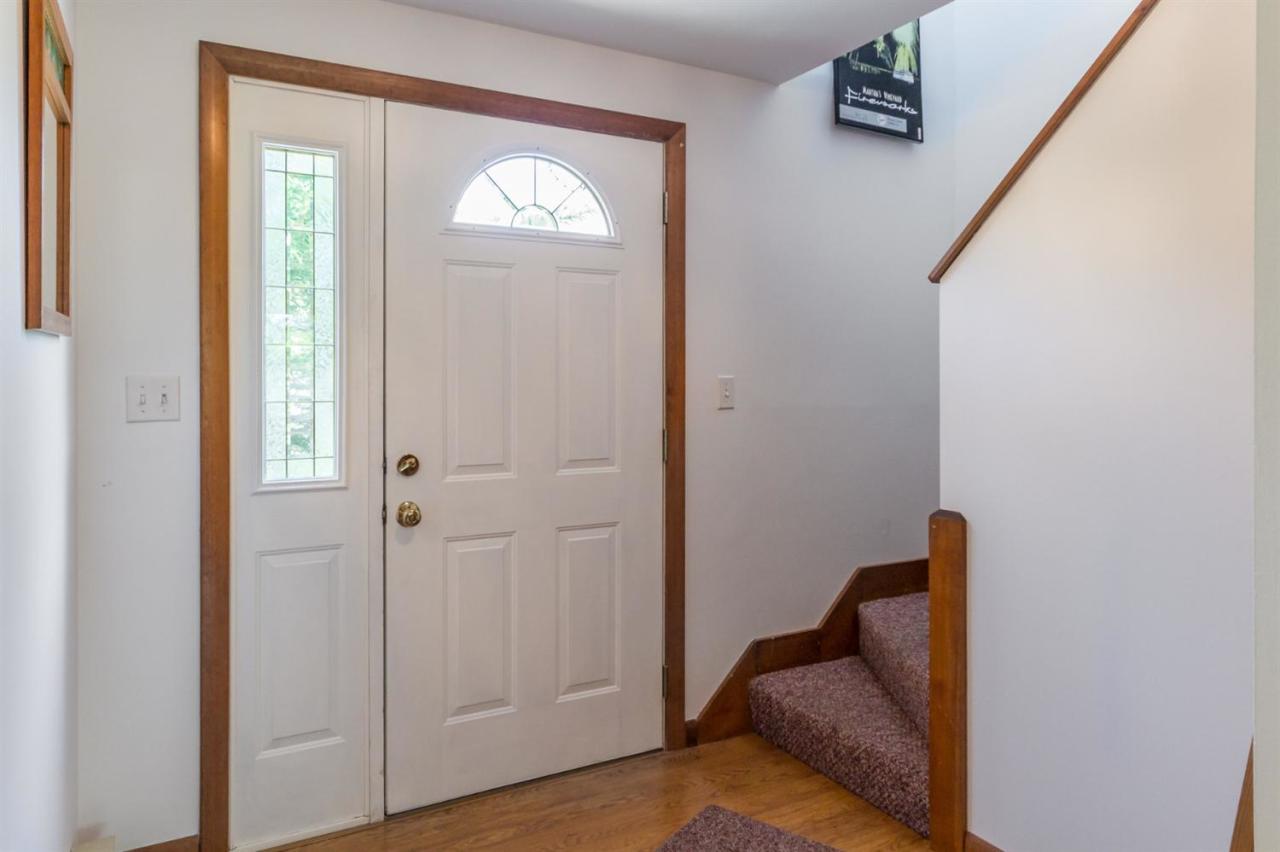 1 Schoolhouse Road Edgartown, MA 02539 - Photo 9 of 14 a view of hallway with livingroom and stairs