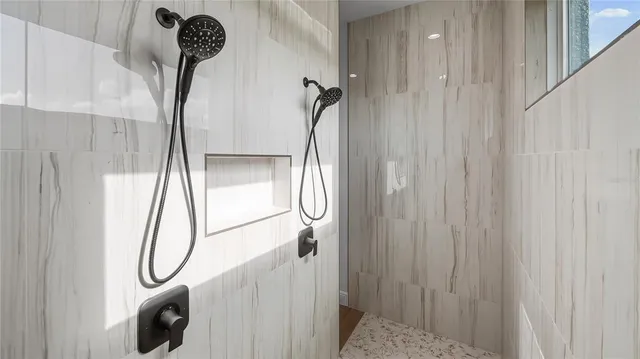 a bathroom with a glass shower door