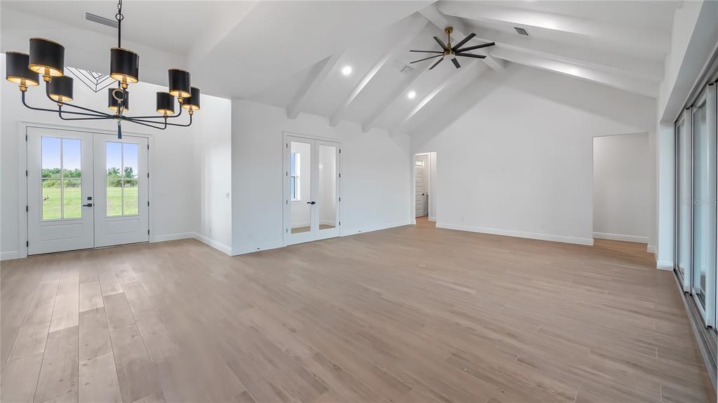 20130 Sugarloaf Mountain Road Clermont, FL 34715 - Photo 10 of 18 an empty room with windows and ceiling fan