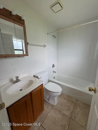 a bathroom with a sink toilet and vanity
