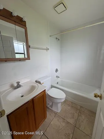 a bathroom with a sink toilet and vanity