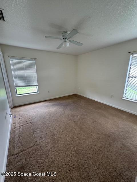 824 Faull Drive, Unit B Rockledge, FL 32955 - Photo 9 of 12 an empty room with windows and closet