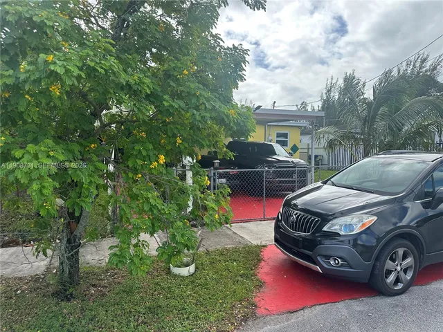 a car parked in front of a house