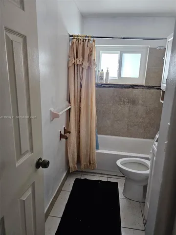 a room with furniture and a window