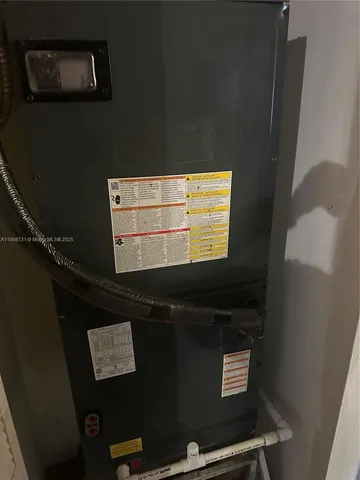 a view of a hallway with workspace and a refrigerator