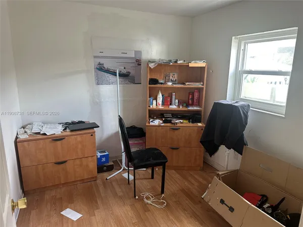 a view of a livingroom with furniture and window