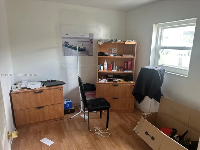 a view of a livingroom with furniture and window