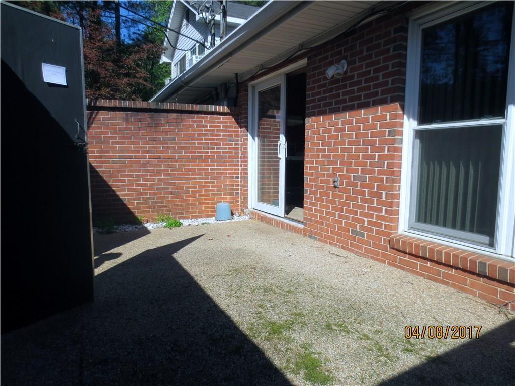 3268 Henderson Mill Road, Unit C Atlanta, GA 30341 - Photo 3 of 3 a front view of a house with a garden