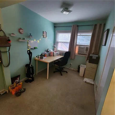 a room with furniture and a window