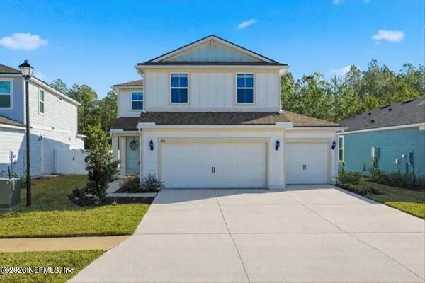 a front view of a house with a garage