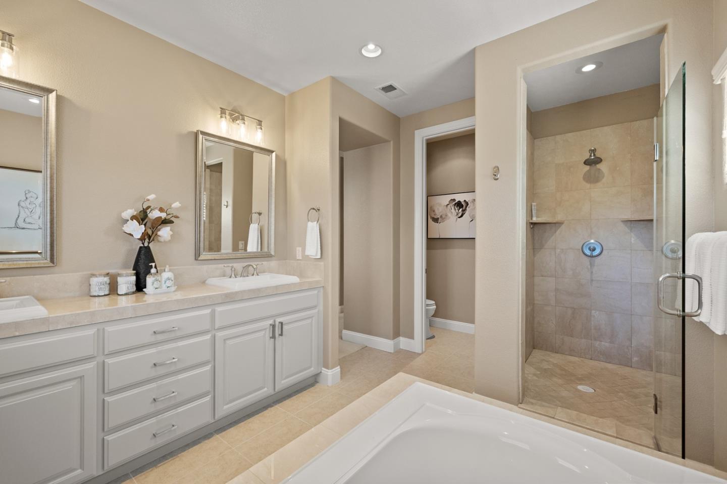 39 Estates Drive Millbrae, CA 94030 - Photo 16 of 19 a spacious bathroom with a shower sink and mirror