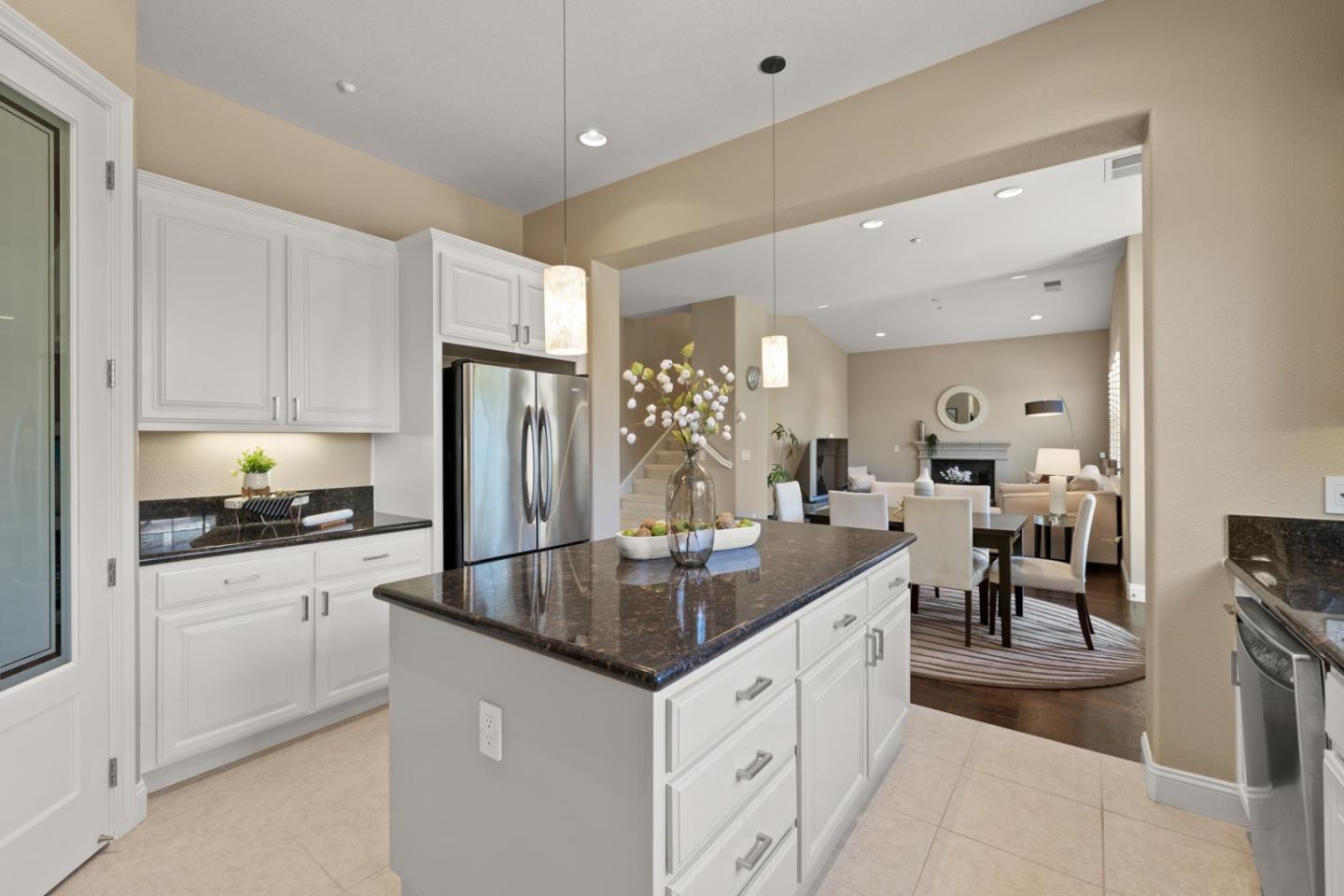 39 Estates Drive Millbrae, CA 94030 - Photo 8 of 19 a kitchen with stainless steel appliances granite countertop a sink refrigerator and cabinets