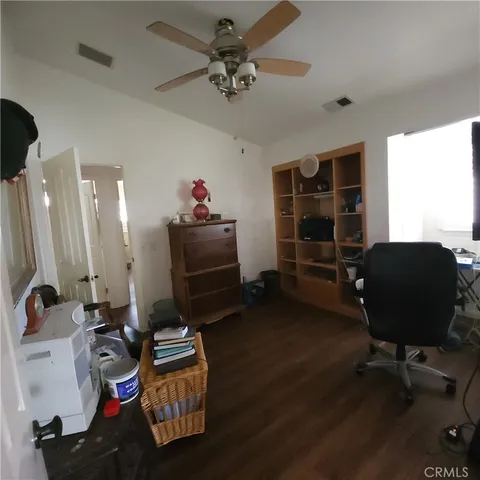 a room with furniture and wooden floor