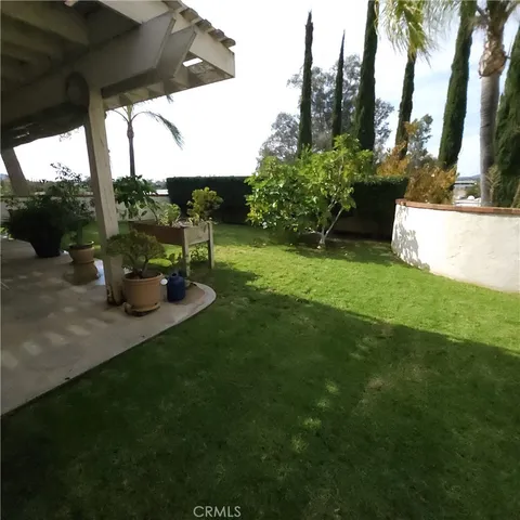 a view of a table and chairs in the garden