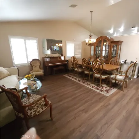 a living room with furniture a lamp and a window