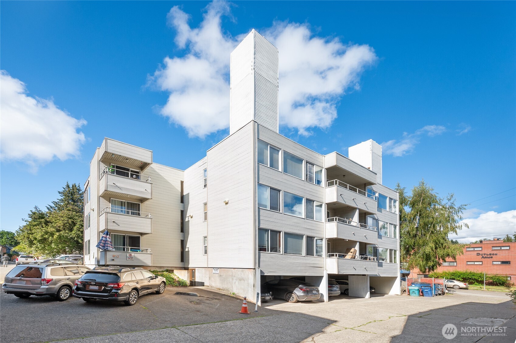 a city street lined with buildings and cars