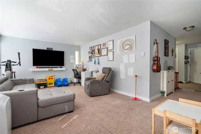 a kitchen with granite countertop a sink stove and cabinets