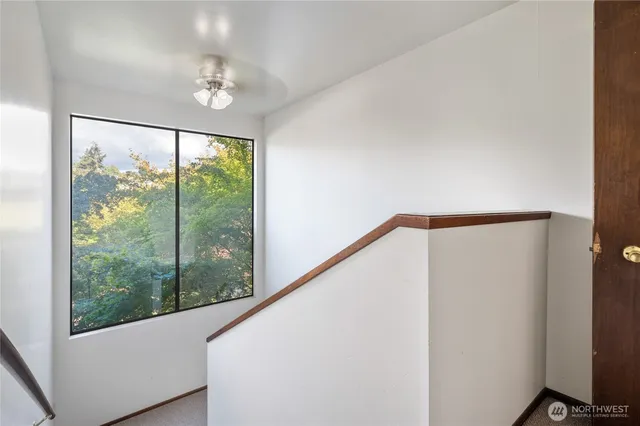 a room with a refrigerator and a stove top oven
