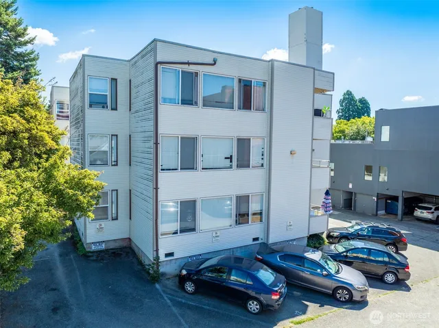 a living room with furniture and flowers