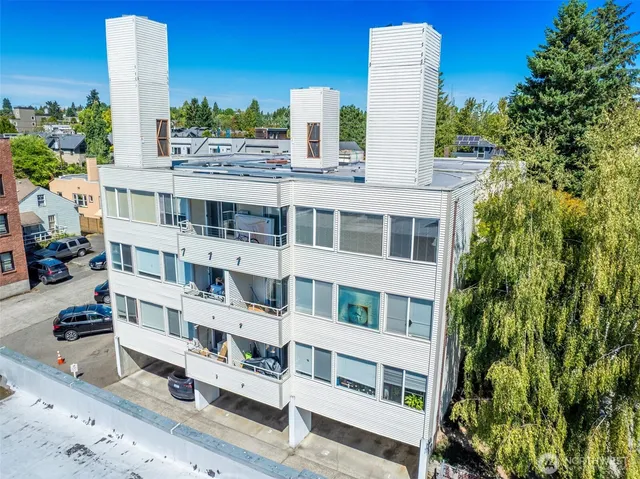 an aerial view of residential house with outdoor space and parking
