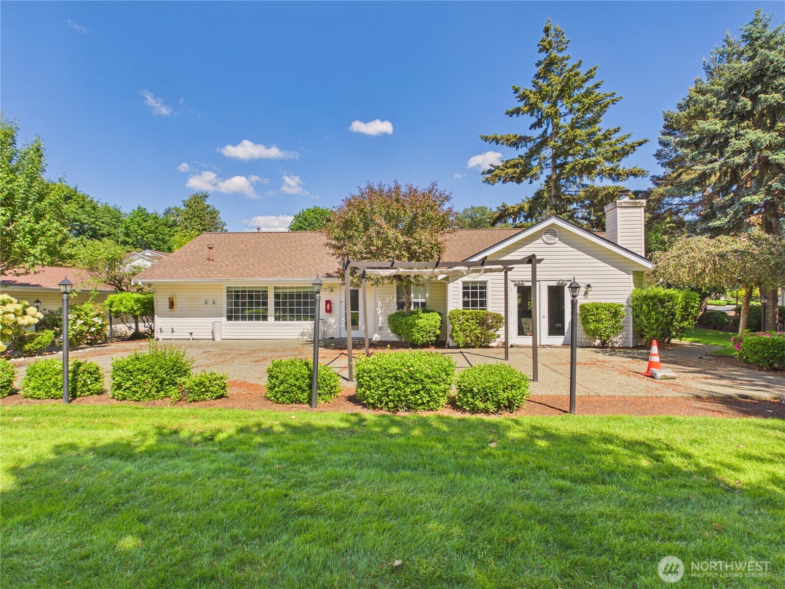 11002 Southeast Petrovitsky Road, Unit I102 Renton, WA 98055 - Photo 18 of 24 a front view of a house with a yard