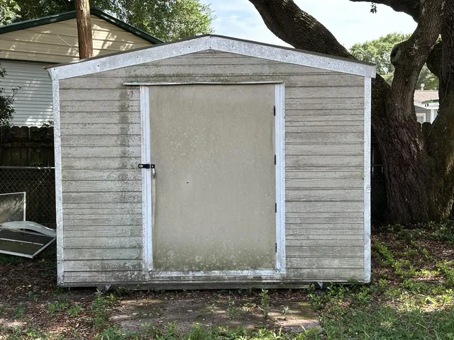 a side view of a house with a yard