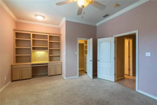a room with closet and racks