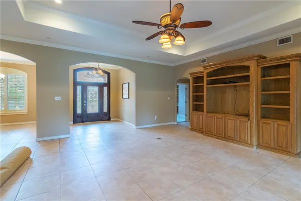 an empty room with a empty space and windows