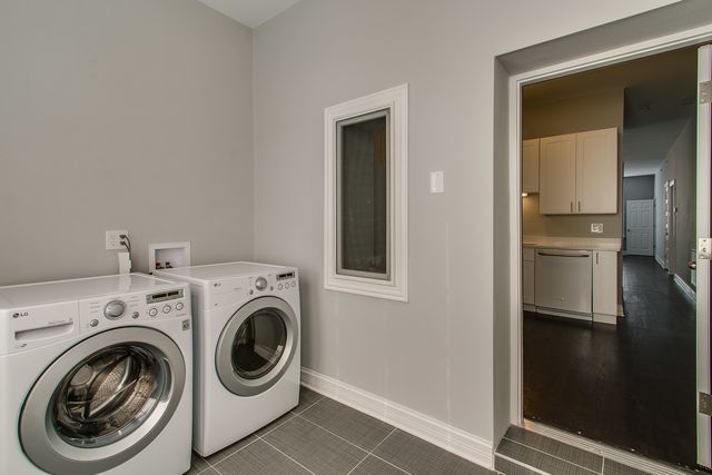 a view of storage and utility room with washer and dryer