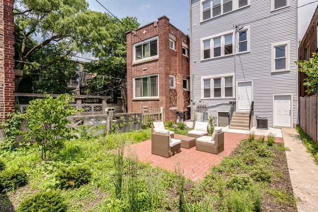 a backyard of a house with seating space