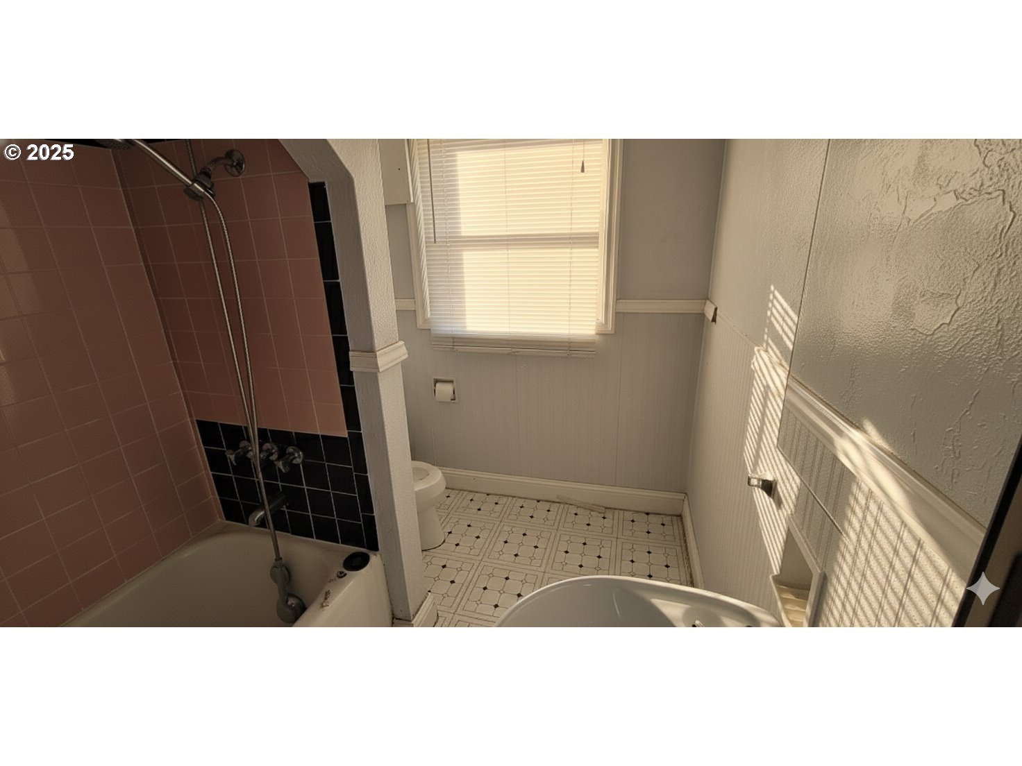 5836 Northeast Halsey Street Portland, OR 97213 - Photo 7 of 12 a picture of a black and white kitchen