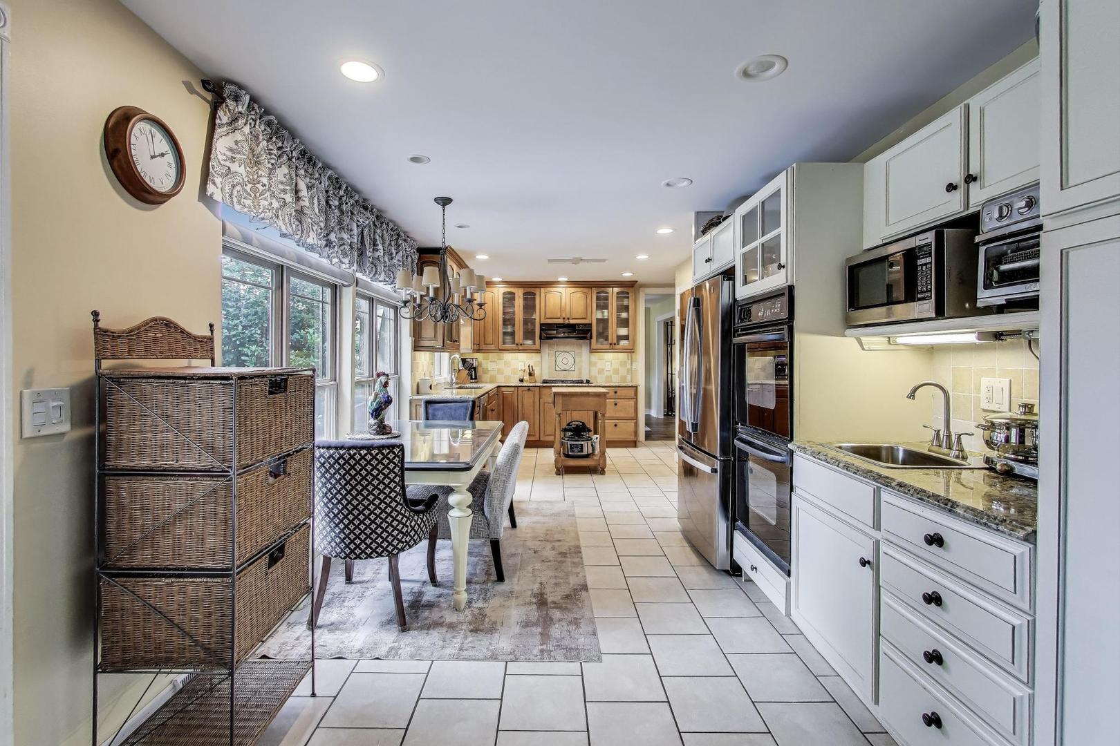 28W409 Leverenz Road Naperville, IL 60564 - Photo 13 of 39 a kitchen with stainless steel appliances granite countertop a refrigerator and a stove top oven