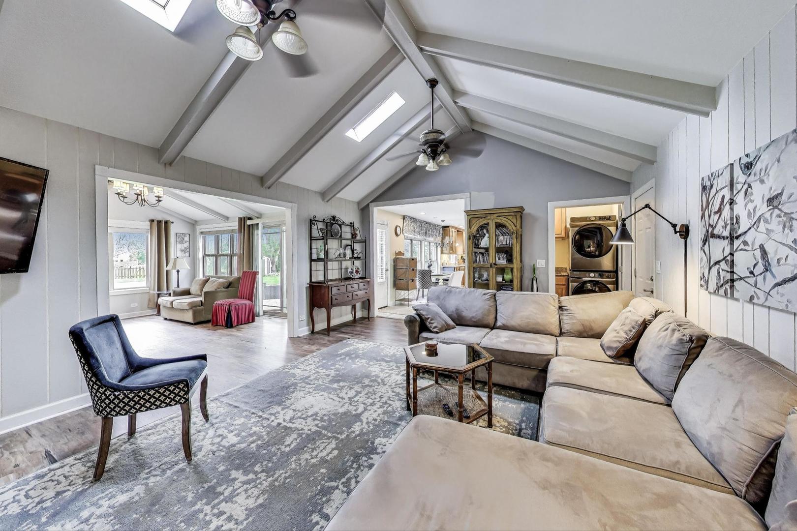 28W409 Leverenz Road Naperville, IL 60564 - Photo 15 of 39 a living room with furniture and a chandelier