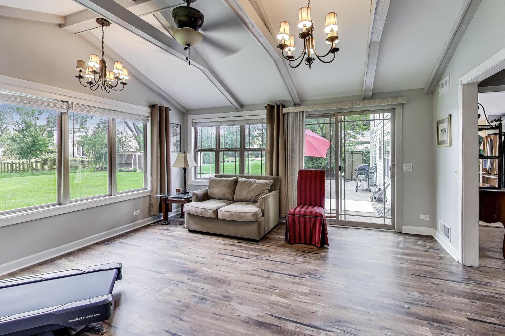 28W409 Leverenz Road Naperville, IL 60564 - Photo 17 of 39 a living room with furniture and chandelier
