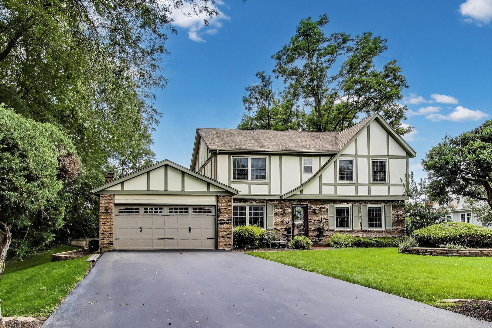 28W409 Leverenz Road Naperville, IL 60564 - Photo 2 of 39 a view of a house with a yard and potted plants
