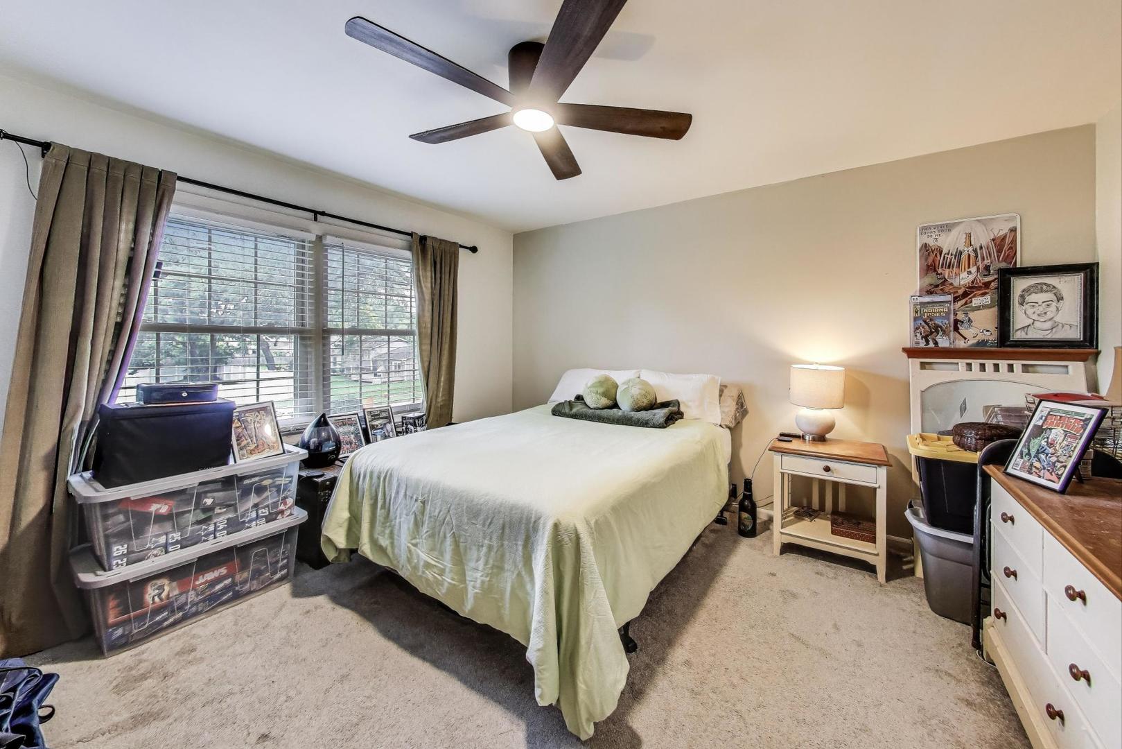 28W409 Leverenz Road Naperville, IL 60564 - Photo 25 of 39 a bed room with a bed and a television