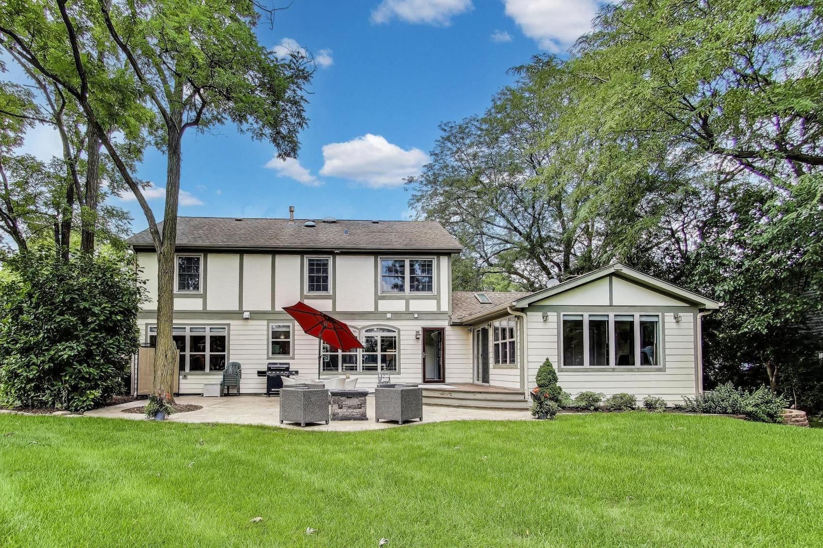 28W409 Leverenz Road Naperville, IL 60564 - Photo 28 of 39 a patio that has couches chairs and a big yard