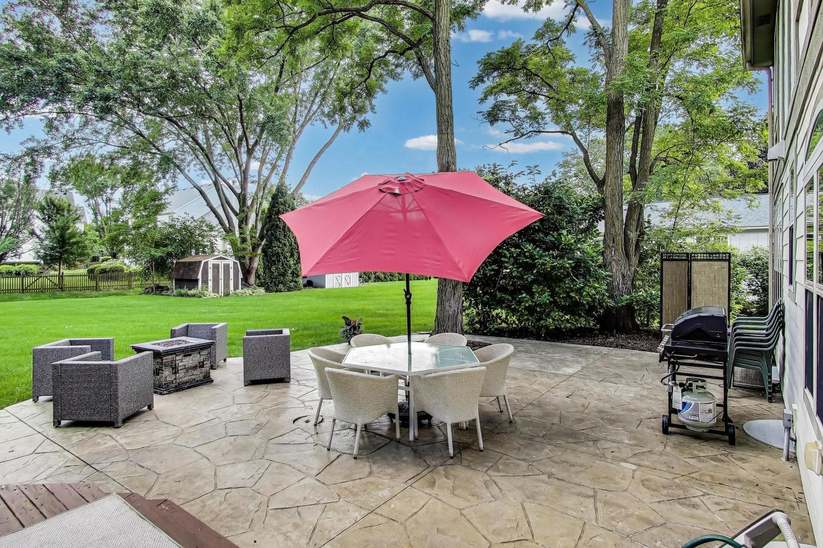 28W409 Leverenz Road Naperville, IL 60564 - Photo 32 of 39 an outdoor sitting area with couch and a garden