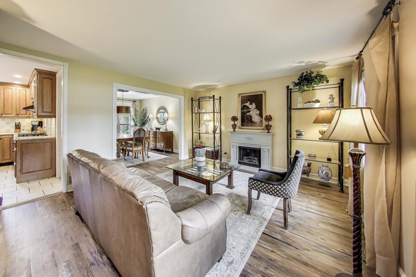 28W409 Leverenz Road Naperville, IL 60564 - Photo 4 of 39 a living room with furniture and a fireplace