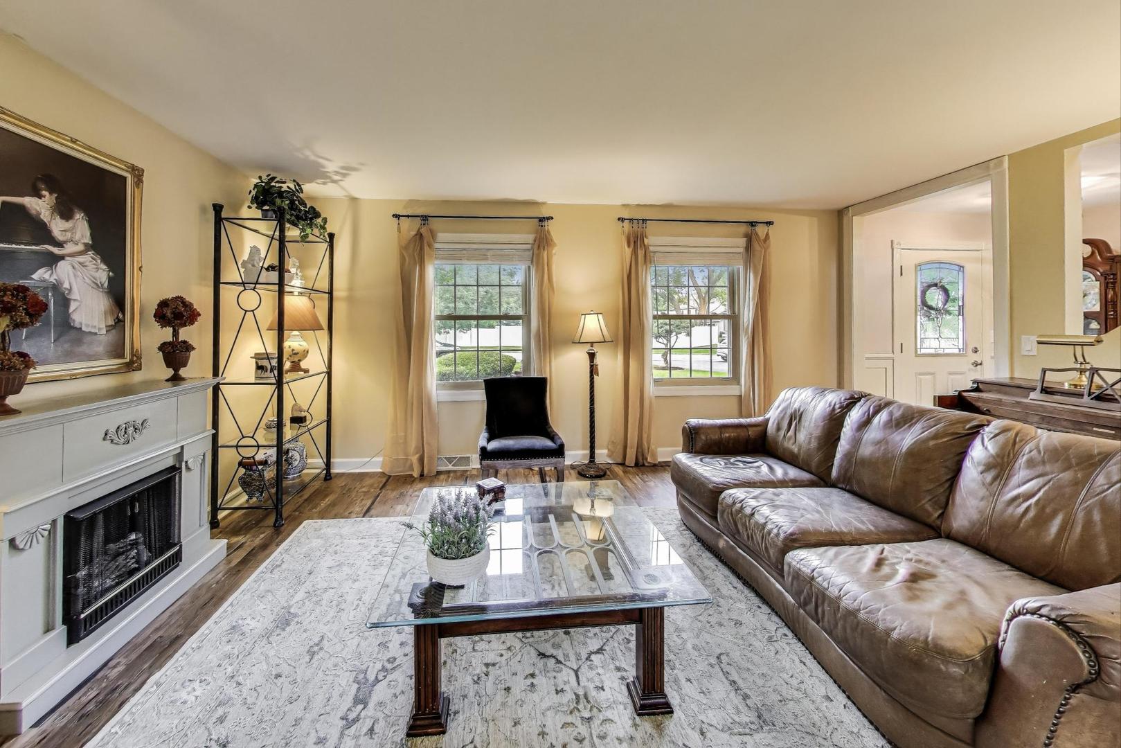 28W409 Leverenz Road Naperville, IL 60564 - Photo 5 of 39 a living room with furniture flat screen tv and a fireplace