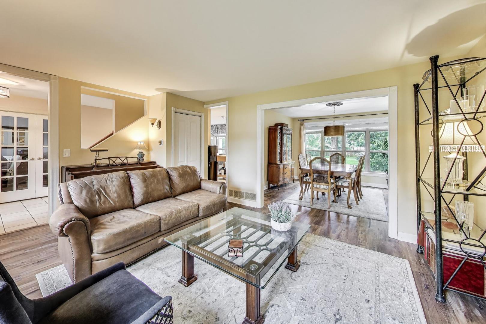 28W409 Leverenz Road Naperville, IL 60564 - Photo 6 of 39 a living room with furniture and a wooden floor